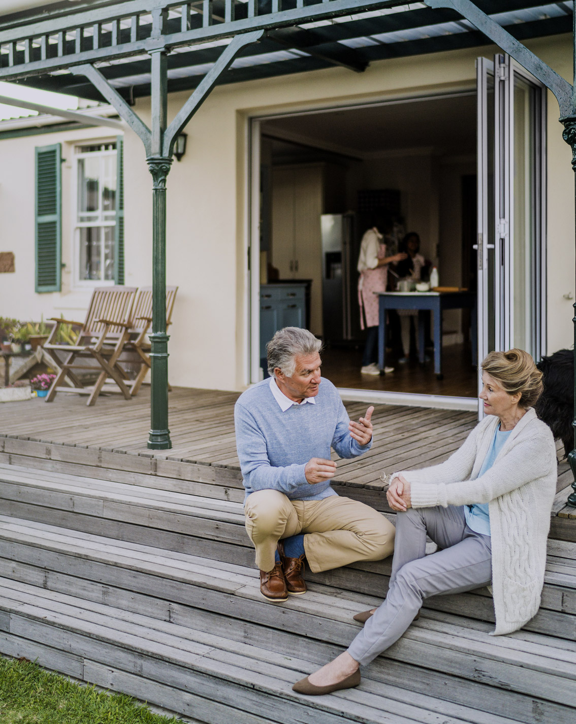 Elderly couple setting on the front porch